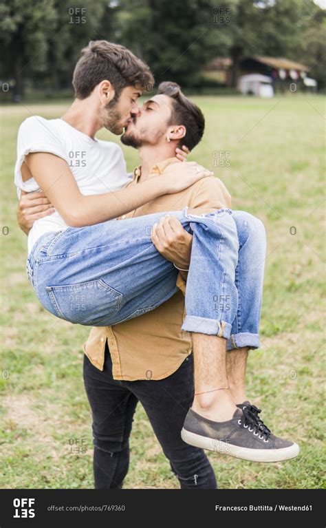 Adult male couple kissing in a park. man stands in a corner facing the wall and wraps his arms around him so that it looks like he is kissing someone passionately. - gay men kiss stock videos & royalty-free footage. 00:49. Gay man mimes passionate kiss, 1969. 
